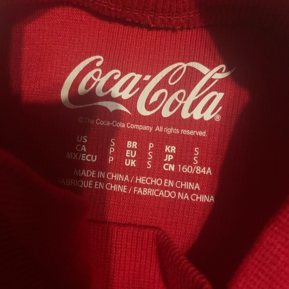 A crew neck with the coca cola logo on it - Picture 2 of 2